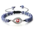 Bracelet œil maléfique en perles bleues avec pendentif en métal strass et cordon réglable. - Bleu Tacheté de Blanc Argent