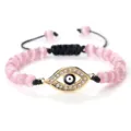 Bracelet de perles roses avec pendentif œil grec doré, cordon tressé réglable cadeau idéal. - Oeil de Chat Rose Or