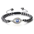 Bracelet de perles avec œil bleu turc, strass scintillants et cordon noir réglable. - Hématite Argent