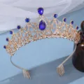 Gold rhinestone bridal tiara detail, featuring blue crystal stones and secure hair combs. - Gold with Blue Zirconia