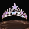 Close-up detail of the handmade ocean starfish and seashell crown, sparkling tiara design - Purple