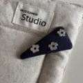 Denim blue hair clip featuring silver flower studs, chic triangle design for stylish daily hairstyles. - Triangle Snap Clip / Denim Blue