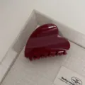 Detailed view of a glossy dark red heart-shaped hair claw clip, elegant minimalist daily accessory. - Heart / Gold Glitter Red
