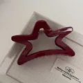 Red star hair claw clip detail shot showing glossy finish and metal spring mechanism - Pentagram / Gold Glitter Red
