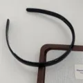 Black plastic hair hoop with teeth detail showcase, simple daily hair accessory item. - Black