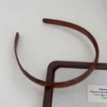 Brown plastic toothed hair band detail view, minimalist daily hair accessory for women. - Brown