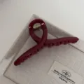 Red hair claw clip detail, stylish hair accessory for women, elegant daily wear design. - Hanger / Gold Glitter Red