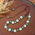 Retro Chinese style beaded necklace with turquoise patterned beads and adjustable brown cord. - Turquoise Gold-Patterned Round Bead Style (C23-522)