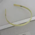 Minimalist pale yellow acetate headband with teeth, smooth finish, elegant daily hair accessory. - Light Green Acetate Headband