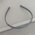 Close up view of a simple grey anti-slip hair hoop detail showing inner teeth design. - Blue Acetate Headband