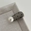 Close-up detail of the sweet polka dot pearl hair clip, showing the glossy finish and elegant design. - Water Drop Pearl Clip / Premium Grey