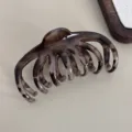 Detailed close-up view of a stylish tortoiseshell hair claw clip, perfect for daily styling. - Pumpkin Shape - Leopard Hair Claw / 10.5cm / Gray Leopard