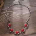 Close-up detail of vintage bohemian ethnic style red stone statement necklace silver chain. - Silver Base Red (C23-605 D3-F1)