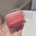 Detail view of five gradient pink velvet hair ties set inside a clear storage box. - Pink Tones