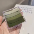 Gradient green seamless hair ties in a transparent box, soft elastic scrunchies detail view - Green Series