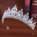 Detailed shot of a silver rhinestone crown tiara, perfect for party, prom, and queen updo styles. - Opal Silver