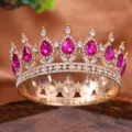 Detailed closeup of exquisite gold full circle alloy tiara featuring pink teardrop gems. - Rose Red