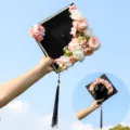 Graduation cap with floral and pearl decor, black mortarboard with pink flowers for party. - Style 9
