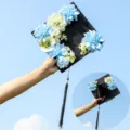 Graduation cap with blue and white floral decoration and tassel for party celebration photo prop. - Style 11