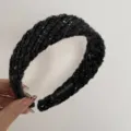 Detailed view of the black chunky knit tweed headband featuring a soft textured design. - Headband / Black