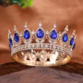 Round alloy crown tiara with blue teardrop crystals and clear rhinestones for wedding party. - Blue