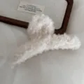Cozy fluffy plush hair claw clip in creamy white, large size winter hair accessory detail. - White