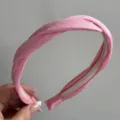 Pink twisted fabric hair hoop detail showing soft texture and inner teeth design for daily wear. - Simple Twist Headband / Deep Pink