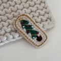 Handcrafted crochet Christmas tree hair clip detail, cute knitted hair accessory, cozy texture. - Christmas Series - Slim Tree