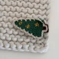 Handcrafted crochet Christmas tree hair clip detail view, cute knit side clip for sweet girls. - Christmas Tree - Three Stars