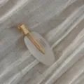 Minimalist oval hair clip with gold metal duckbill clip, elegant daily hair accessory detail. - White