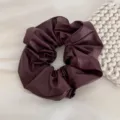 Dark maroon leather scrunchie detail view, elegant soft hair tie accessory for women. - Scrunchie / Burgundy
