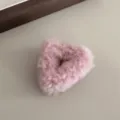 Pink fluffy hair claw clip detail shot, cute plush triangular design for sweet daily styles. - Pink