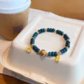 Retro Chinese style blue jadeite bead bracelet with gold gourd and wealth charms for women - 6*2mm Wheel Bead + Fortune Tag