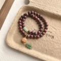 Retro Chinese sandalwood double layer beaded bracelet with elegant jade charms and tassel details. - Pumpkin Tassel Pendant Style