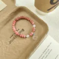 Sweet pink quartz abacus bead bracelet with cute jade peace buckle pendant for daily wear. - Peace Buckle Style