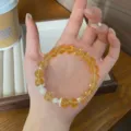 Elegant yellow crystal bracelet with pearl accents, delicate beaded design for daily wear. - Shell Pearl Style