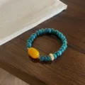 Detail shot of Chinese style retro chalcedony abacus bead bracelet with yellow agate and pearl. - 8*4mm Wheel Bead Style