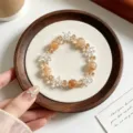 Detailed close-up of the elegant yellow crystal beaded bracelet with clear star crystal charms. - Citrine Quartz With UFO Artificial Crystal