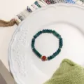 Exquisite Chinese style retro beaded bracelet with green and red agate beads for women detail view - 6*2mm Wheel Bead + Red Agate