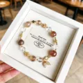 Elegant natural crystal and metal leaf pendant bracelet in a fine white presentation gift box. - Rutilated Quartz Style