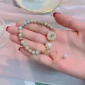 Close-up detail of the vintage national style jade bead bracelet with pearl and donut pendant. - 9 Pingan Buckle Style