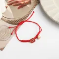 Red braided string bracelet with cute bell and pendant for festival gift and everyday wear. - Everything Cute