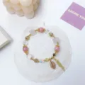 Charming pink crystal charm bracelet with dazzling leaf pendant and tassel for women. - Pink