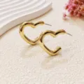 Gold heart-shaped earrings detail view, minimalist metal design for trendy daily wear showcase. - Simple Heart Style (A24-111P) / Gold