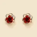 Close-up detail view of elegant red rose earrings with sparkling rhinestones and gold finish. - Rose Flower Style (HY872) / Red