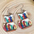 Close-up detail of cute wooden cat bookshelf pendant earrings, stylish and unique jewelry. - Cat Style (A23-913)