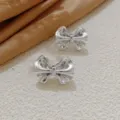 Koreanische silberne gepuffte Schleifen Ohrringe fuer Damen, schicker glaenzender Metallschmuck. - 3D Schleife Stil (A24-159R)