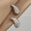 Close-up detail of silver hammered conch stud earrings featuring a unique metallic textured design. - Small Hammered Conch Style (A24-114R 2.7cm)