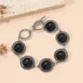 Vintage silver tone bracelet with black round charm design, boho chic wrist jewelry variant. - Black Bead Style / Silver Black