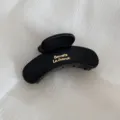 Matte black hair claw clip with gold lettering, large cloud design for thick hair styling. - Small Fan Gold-Labeled Hair Claw / Black